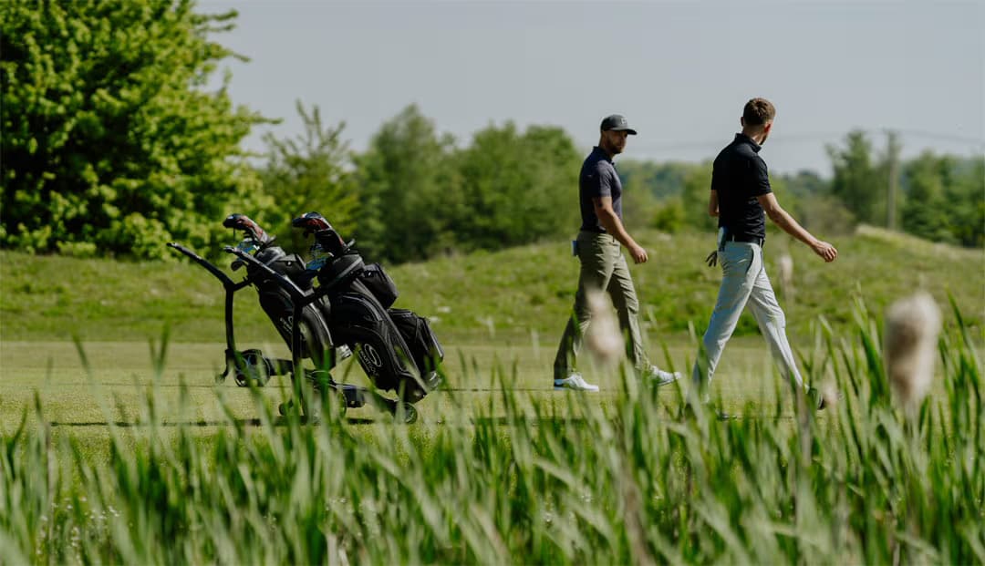 Stewart Golf Q Follow Electric Trolley and walking golfers