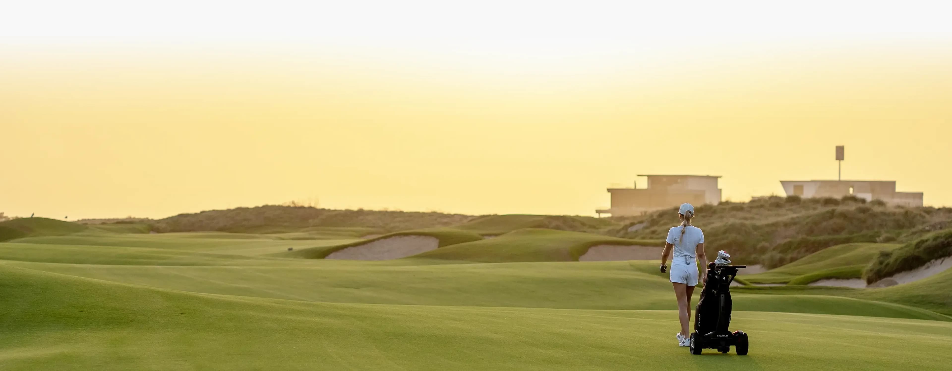 Golfer walking on a course